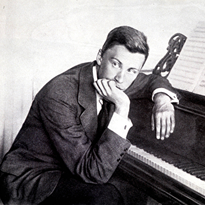Sergei Prokofiev and his piano, 1910 (b / w photo)