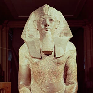Statue of Queen Makare Hatshepsut (1503-1482 BC) holding two vases containing offerings