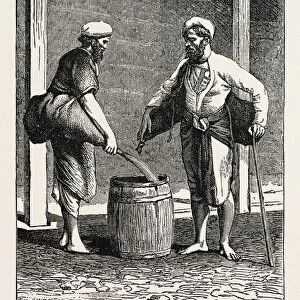 WATER CARRIERS OF CALCUTTA, INDIA. Kolkata, or Calcutta is the capital of the Indian