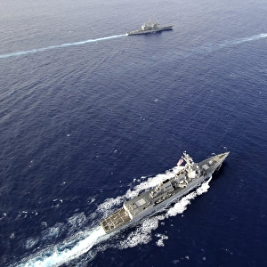 Aerial view of a naval fleet transiting the Pacific Ocean