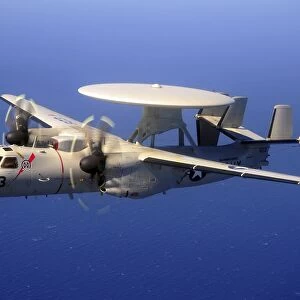 An E-2C Hawkeye flying over the Pacific Ocean