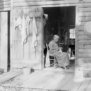 An elder woman knitting on a farm near Bulls Gap, Tennessee, 1933
