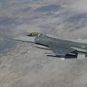 An F-16 maneuvers during a training mission over Arizona