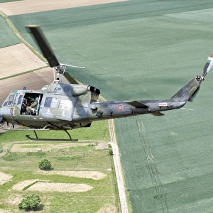 An Italian Air Force AB-212 ICO helicopter in flight over France