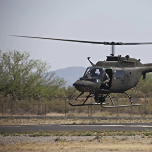 An OH-58 Kiowa helicopter of the U. S. Army landing at Pinal Airpark, Arizona