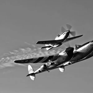 A P-38 Lightning and P-51D Mustang in flight