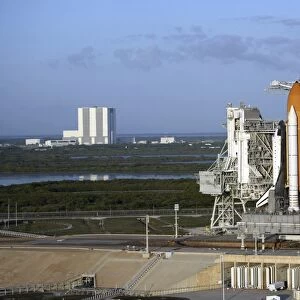Space shuttle Atlantis atop the mobile launcher platform sits on the launch pad