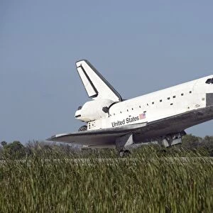 Space shuttle Atlantis touches down on Runway 33 at the Kennedy Space Center in Florida