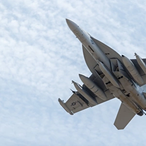 A U. S. Navy E / A-18G Growler takes off from Nellis Air Force Base, Nevada