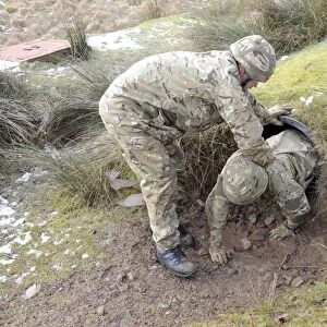 Welsh Guards perform basic training on the assault course at Sennybridge Training Area