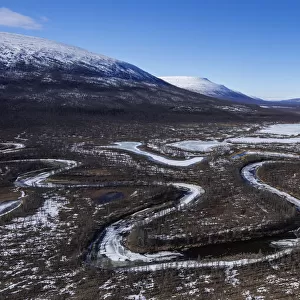 River meandering through remote valley, Putoransky State Nature Reserve, Putorana Plateau, Siberia, Russia. May, 2021