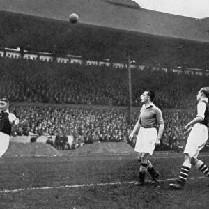 Acrobatics in a Arsenal v Chelsea match at Stamford Bridge, London, c1933-c1938. Artist: Sport & General