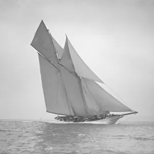 The beautiful schooner Cetonia making good headway, 1911. Creator: Kirk & Sons of Cowes