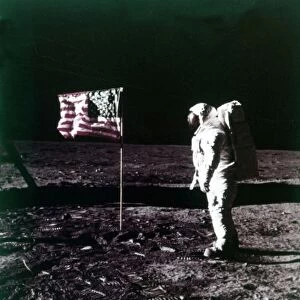 Buzz Aldrin stands next to the American flag on the surface of the Moon, July 1969