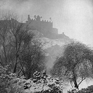 Edinburgh Castle in the snow, from Princes Street Gardens, Scotland, 1924-1926. Artist: W Reid