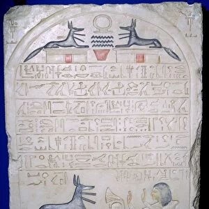 Egyptian elief stele of a man adoring Anubis