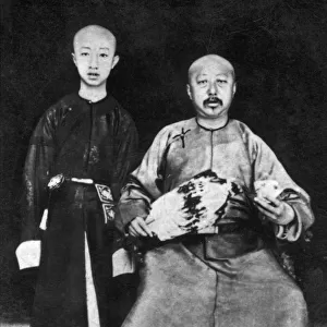 The Emperor of China and his father, 20th century. Artist: Ogdens Guinea Gold Cigarettes