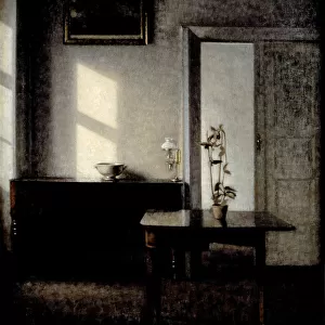 Interior with potted plant on card table, 1910-1911. Artist: Hammershoi, Vilhelm (1864-1916)