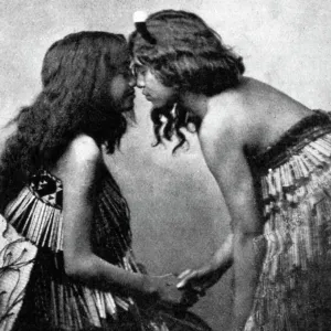 Maori girls rubbing noses, c1920