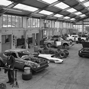 Modified Fords during race preparation, Littleborough, Greater Manchester, 1972. Artist