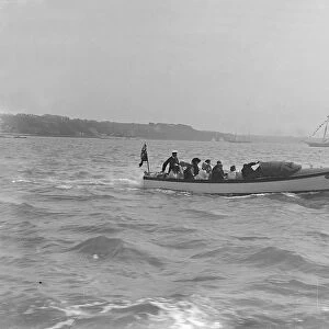 Modwenas motor launch with Modwena in the background, 1911. Creator: Kirk & Sons of Cowes