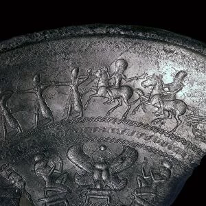 Detail of a Phoenician silver bowl showing soldiers attacking a city, 7th century BC