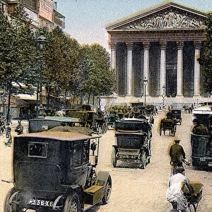 Rue Royale and the Madeleine, Paris, with cars and a motorbus on the street, c1900