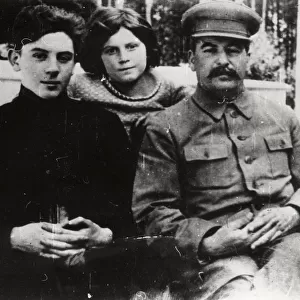 Soviet leader Josef Stalin with his son Vasily and daughter Svetlana, 1930s. Artist: Pyotr Otsup