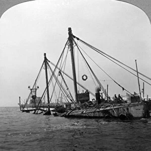 Sunken warship HMS Vindictive, Ostend, Belgium, World War I, 1918. Artist: Realistic Travels Publishers