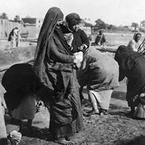 Women collecting water at on the Tigris River, Baghdad, Iraq, 1917-1919