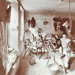 Women using spinning wheels, Bethnal Green, London, 1908