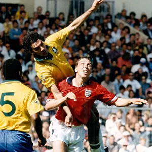 England's David Platt under pressure from Brazil's Ricardo II