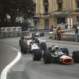 1969 Monaco Grand Prix: John Surtees, BRM P138, leads Jack Brabham, Brabham BT26A Ford, Bruce McLaren, McLaren M7C Ford, and Denny Hulme, McLaren