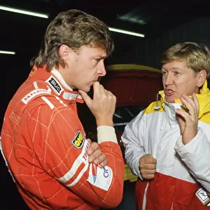 1990 British Touring Car Championship. Robb Gravett (Ford Sierra RS500) in conversation with Mike Smith (Ford Sierra RS500), in the pits, portrait. World Copyright: LAT Photographic. Ref: 90BTCC SM03
