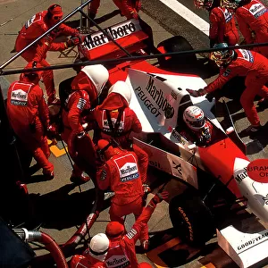 1994 Hungarian Grand Prix. Hungaroring, Hungary. 12-14 August 1994. Martin Brundle (McLaren MP4/9 Peugeot) takes a pitstop on the way to 4th position. Ref-94 HUN 11. World Copyright - LAT Photographic