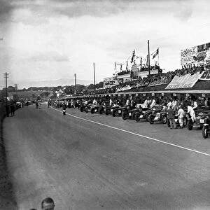 Ards, Northern Ireland, Great Britain. 7 September 1935: The cars line up in front of the pits with WT McCalla and Freddie Dixon / Walter Handley to the fore