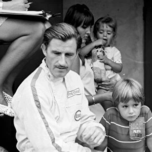 DAMON AND FATHER GRAHAM AT MONZA 67: Graham Hill with a young Damon and Samantha Hill in the pits