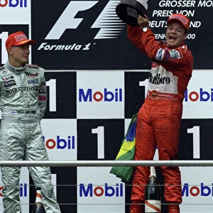 Formula One German Grand Prix Rubens Barrichello celebrates with Mika Hakkinen Hockenheim, 30-07-2000 World Steve Etherington / LAt Photographic