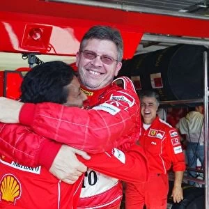Formula One World Championship: Ross Brawn Ferrari Technical Director celebrates with Balbir Singh