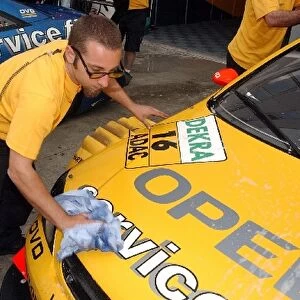 Opel mechanics wash the Opel Astra V8 Coupe in the pitlane: DTM Championship, Rd 2, Adria International Raceway, Italy, 11 May 2003