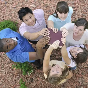 Interracial Group Holding A Bible