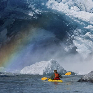 A Kayaker Explores A Melt Stream Gushing From Beneath Mendenhall Glacier, Mendenhall Lake, Tongass National Forest, Juneau, Alaska
