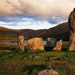 Uragh Stone Circle Under A Cloudy Sky At Sunset; County Kerry, Ireland