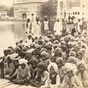Victoria stereo view card from circa 1900, historic social image. Schoolboys of Amritsar, at Golden Temple, beside holy pool; India