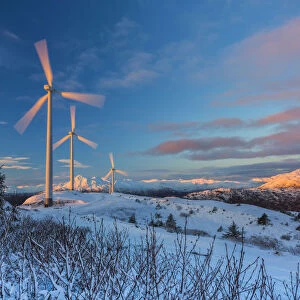 Wind Turbines And Gibbous Moon At Sunrise, Winter, Pillar Mountain; Kodiak, Alaska, United States Of America