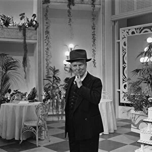 Actor and director Charlie Chaplin legend of the silent movies celebrates his 77th