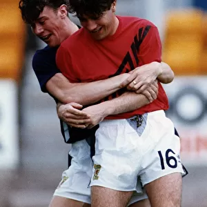 Ally McCoist and Duncan Ferguson wrestling with each other during training football