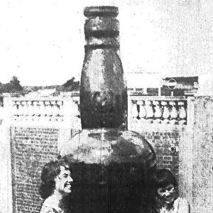 Barry Island - May 1959 - This giant bottle, 10ft high, dwarfs the two preetty girls