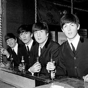The Beatles at the bar in Paris with their Pepsi. Circa January 1964