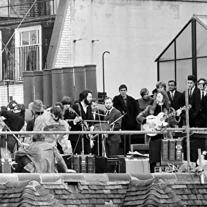 The Beatles perform a rooftop concert at Apple Headquarters